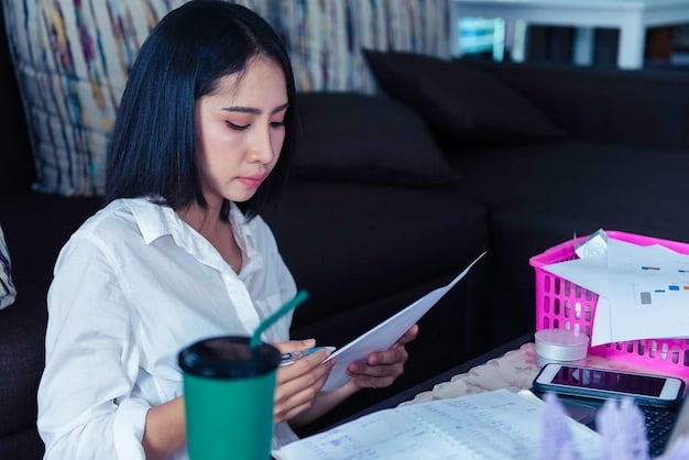 A person reviewing financial documents and using a calculator, emphasizing the importance of financial planning in light of the Student Loan Forgiveness Program review.