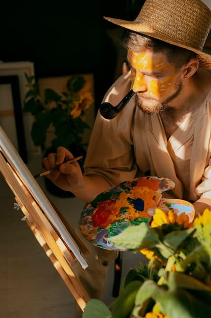 An artist passionately working on a vibrant painting in a sunlit studio, surrounded by brushes, palettes, and canvases, embodying the creative spirit and dedication required for artistic expression.