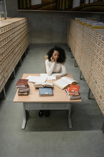A student sitting at a desk surrounded by textbooks, practice tests, and study materials, with a focused expression. The image suggests diligent preparation and a comprehensive approach to studying for standardized tests.