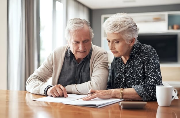 A senior couple is looking over documents to strategize tax tactics for their retirement.