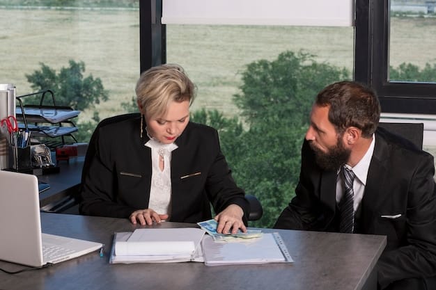 A financial advisor sitting at a table with a client, discussing estate planning documents and strategies.