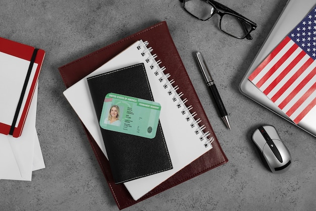 A close-up shot of a U.S. Social Security card with a pen resting on it, alongside a calculator and a notebook with financial notes. The image signifies careful planning and preparation for Social Security benefits.