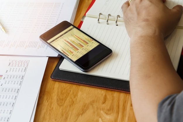 A person using a budgeting app on their smartphone, with charts showing income versus expenses and debt reduction goals. The app displays clear visuals and progress indicators.