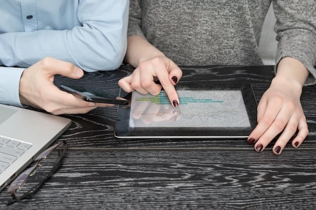 A close-up of a financial advisor's hands pointing to data on a screen, illustrating detailed analysis and personalized recommendations.