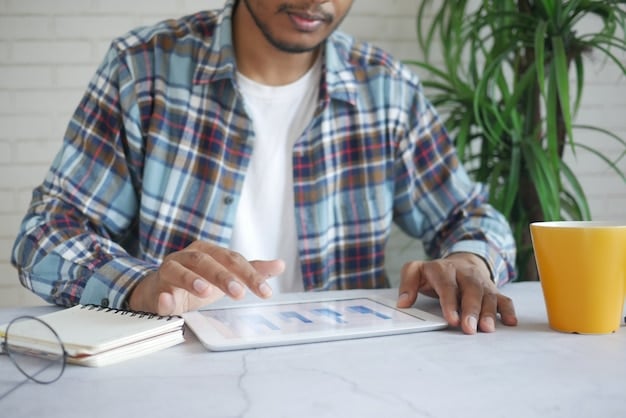 A person sitting at a desk, focused on a tablet, filled with charts, graphs and some money. The scene is set in a pleasant and inspiring home office that conveys the importance of self-development and smart money management.