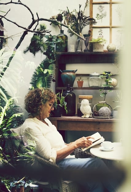 A person working on a laptop at home, surrounded by books and plants. This image represents the various avenues for increasing income through side hustles and online businesses. The lighting is warm and inviting.