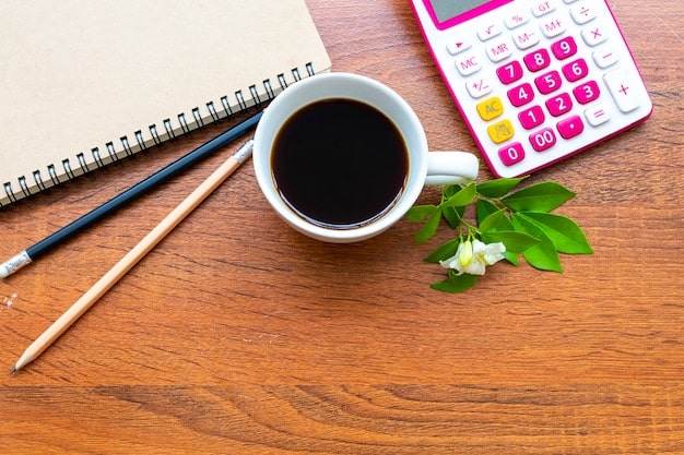 An overhead view of a desk with a pen resting on a tax form, next to a calculator and a cup of coffee. The form is partially filled out, conveying a sense of tax season preparation.