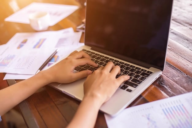 A close-up shot of a person's hands working on a laptop, with spreadsheets and tax documents visible on the screen. The lighting is soft and focused, drawing attention to the act of financial management. The background should be blurred, suggesting a home office environment.