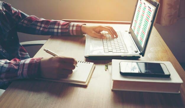 A person studying with a laptop and a calculator, with charts displaying cost comparisons of different education options in the background.
