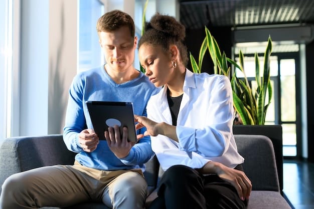 A financial advisor reviewing a long-term care insurance policy with a female client. They are using a tablet to display policy details.
