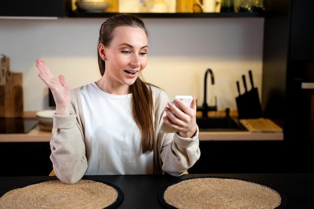 An image showing a person on the phone, smiling and gesturing with their hand. The background is a comfortable living room setting.