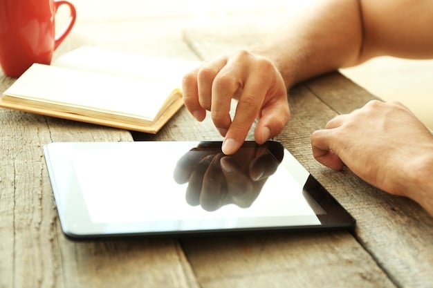 Close-up of a hand filling out the FAFSA form on a tablet. The background is blurred, focusing on the form and the act of completing it.